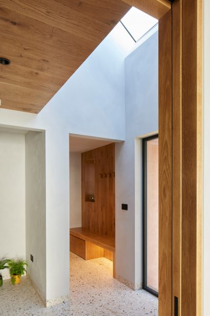 White-walled hallway with terrazzo flooring