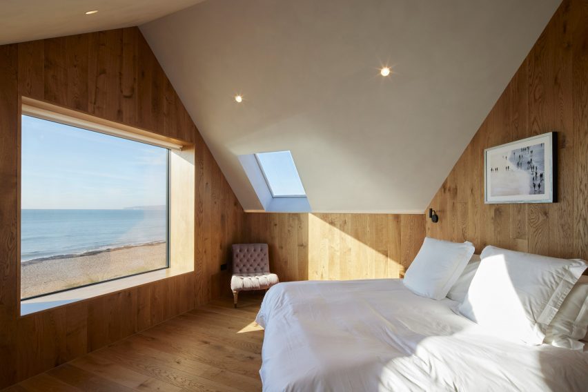 Bedroom with wood-clad walls