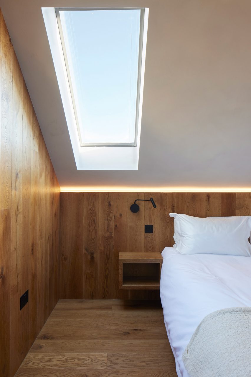 Bedroom with wood-clad walls