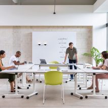 People gathered around a table in office setting