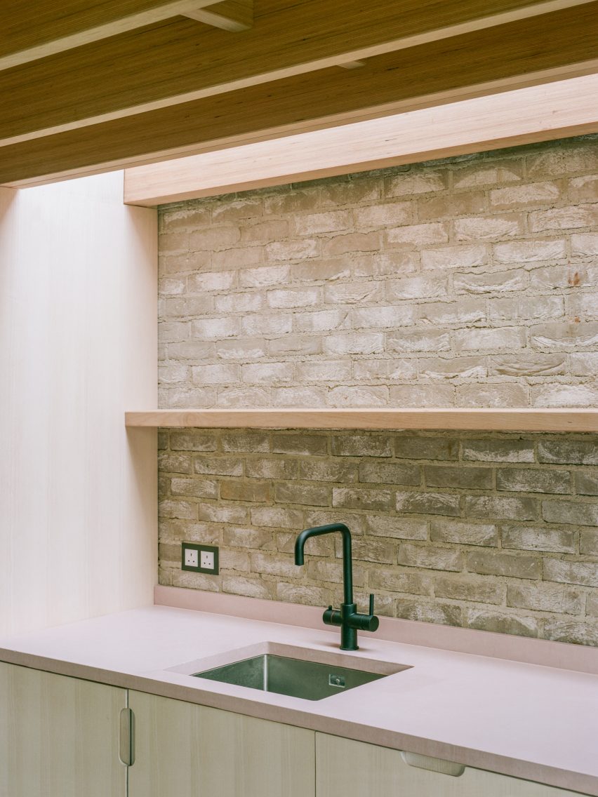 Kitchen with exposed brick walls