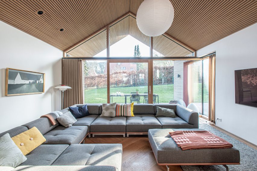 Glazed gable wall and lounge of Villa E by CF Møller Architects