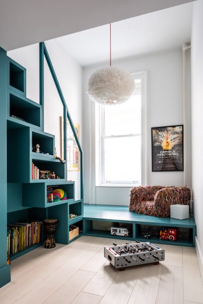 A turquoise staircase and children's toys