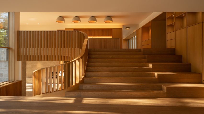 Oak staircase links split levels of Canadian house by Omar Gandhi