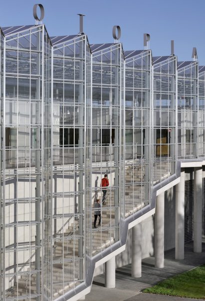 Giant glass and steel structure with signage above it spelling out Agrotopia