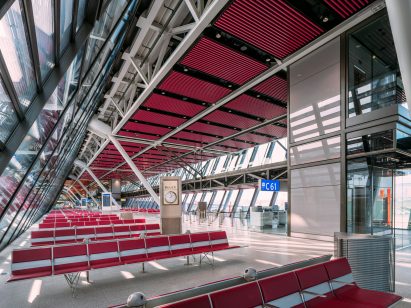 Pink gate at Aile Est airport terminal by RSHP