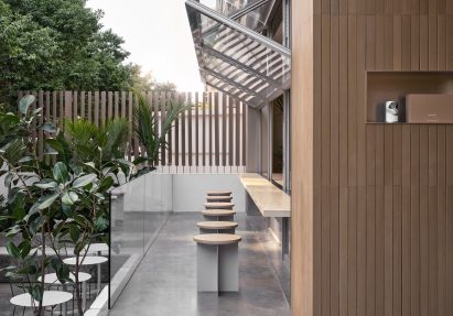 Row of stools in front of window of Basao Tea store