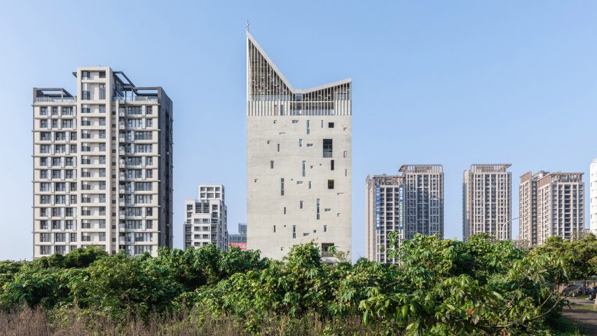 Image of the high-rise church among other tall buildings
