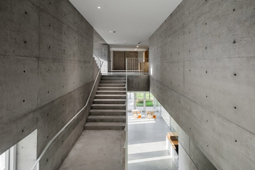 Tamkang Church is a vertical concrete church that was designed by Behet Bondzio Lin Architekten