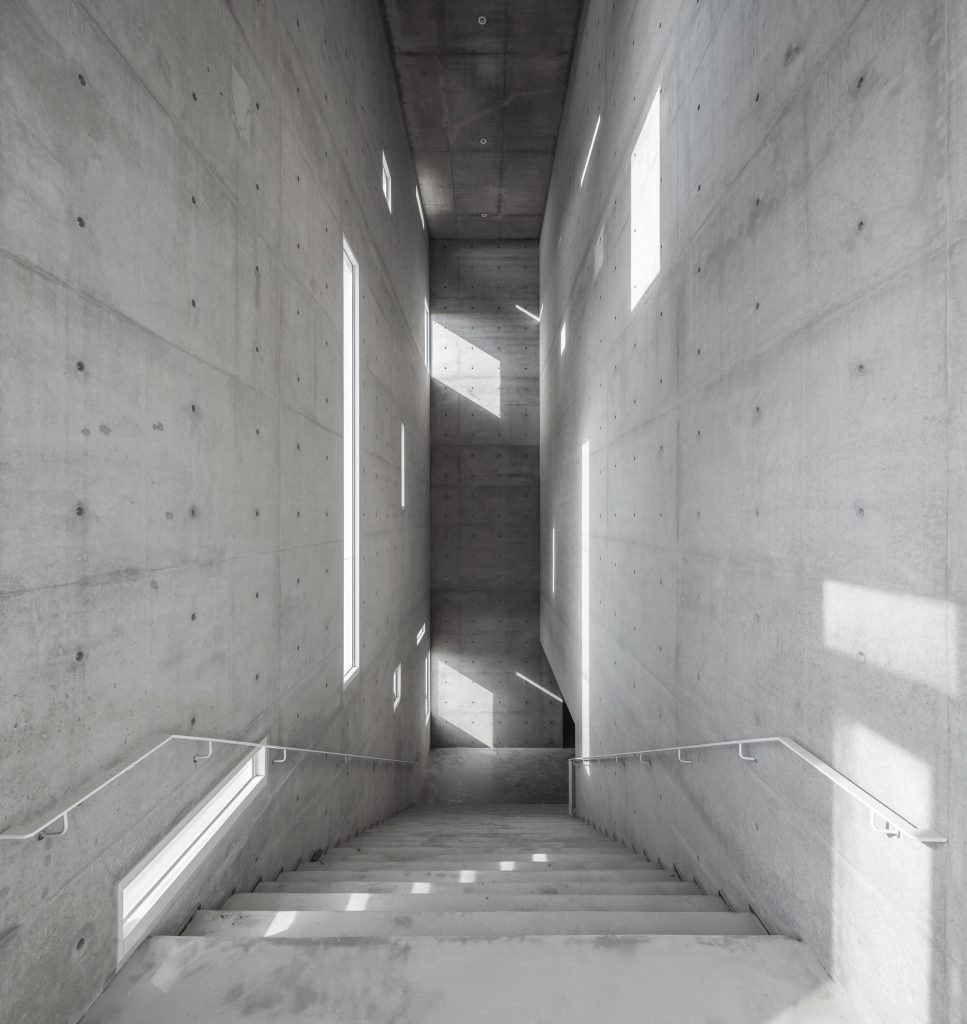 Tamkang Church is a vertical concrete church that was designed by Behet Bondzio Lin Architekten