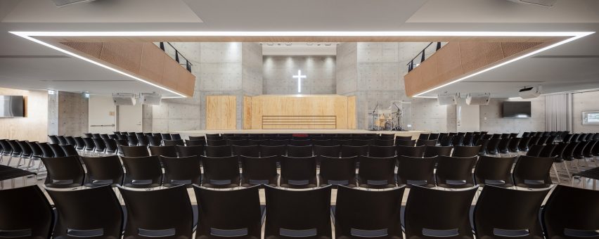 Tamkang Church is a vertical concrete church that was designed by Behet Bondzio Lin Architekten