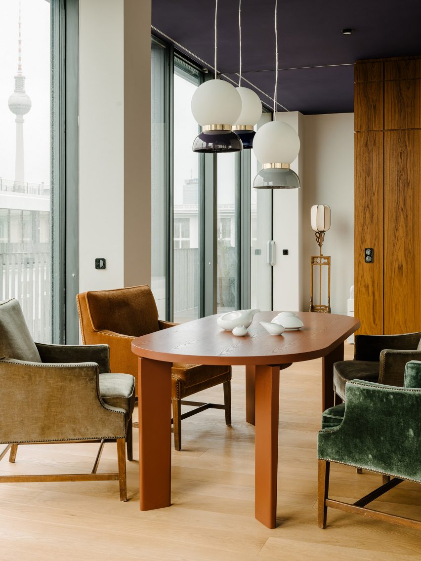 Dining room inside Berlin apartment designed by Gisbert Poppler