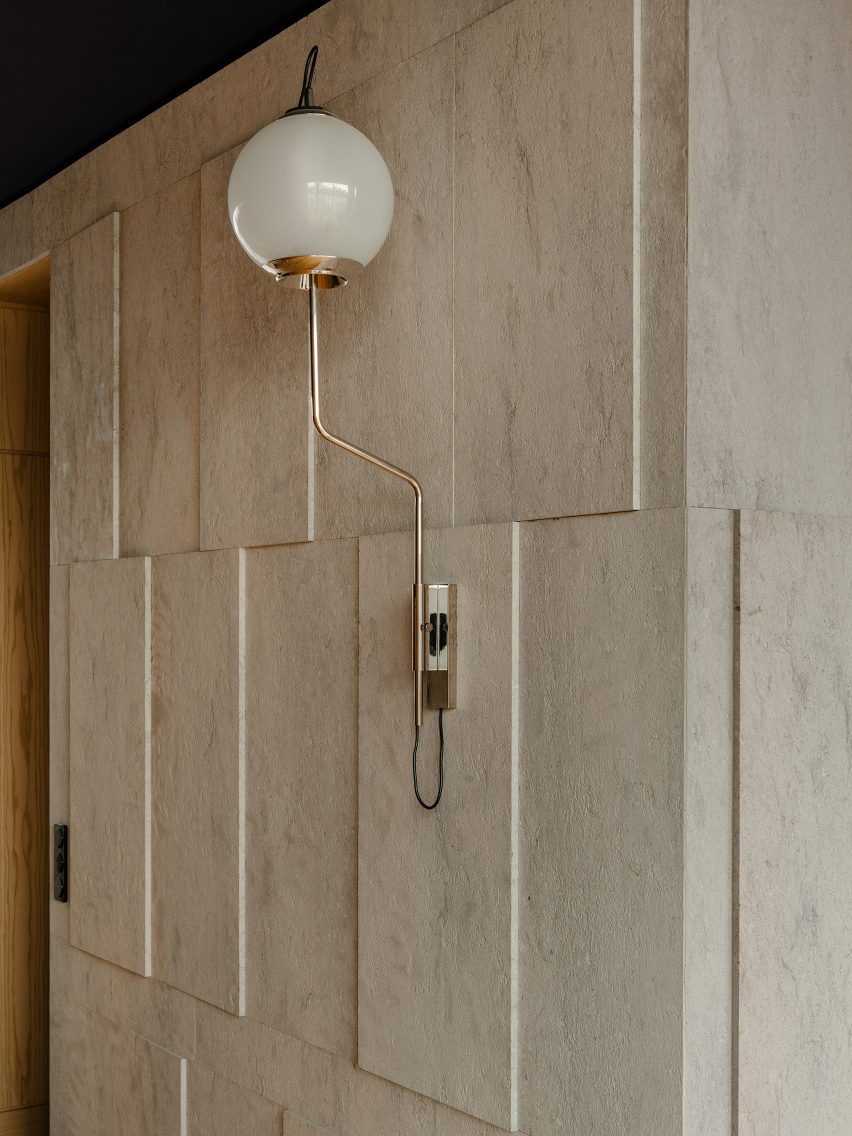 Berlin apartment designed by Gisbert Poppler features relief wall
