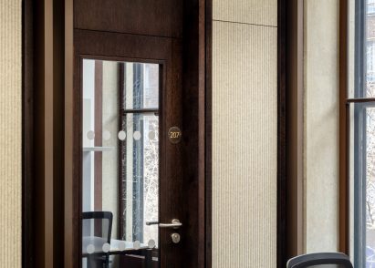 Textural and natural materials cover the walls and floors