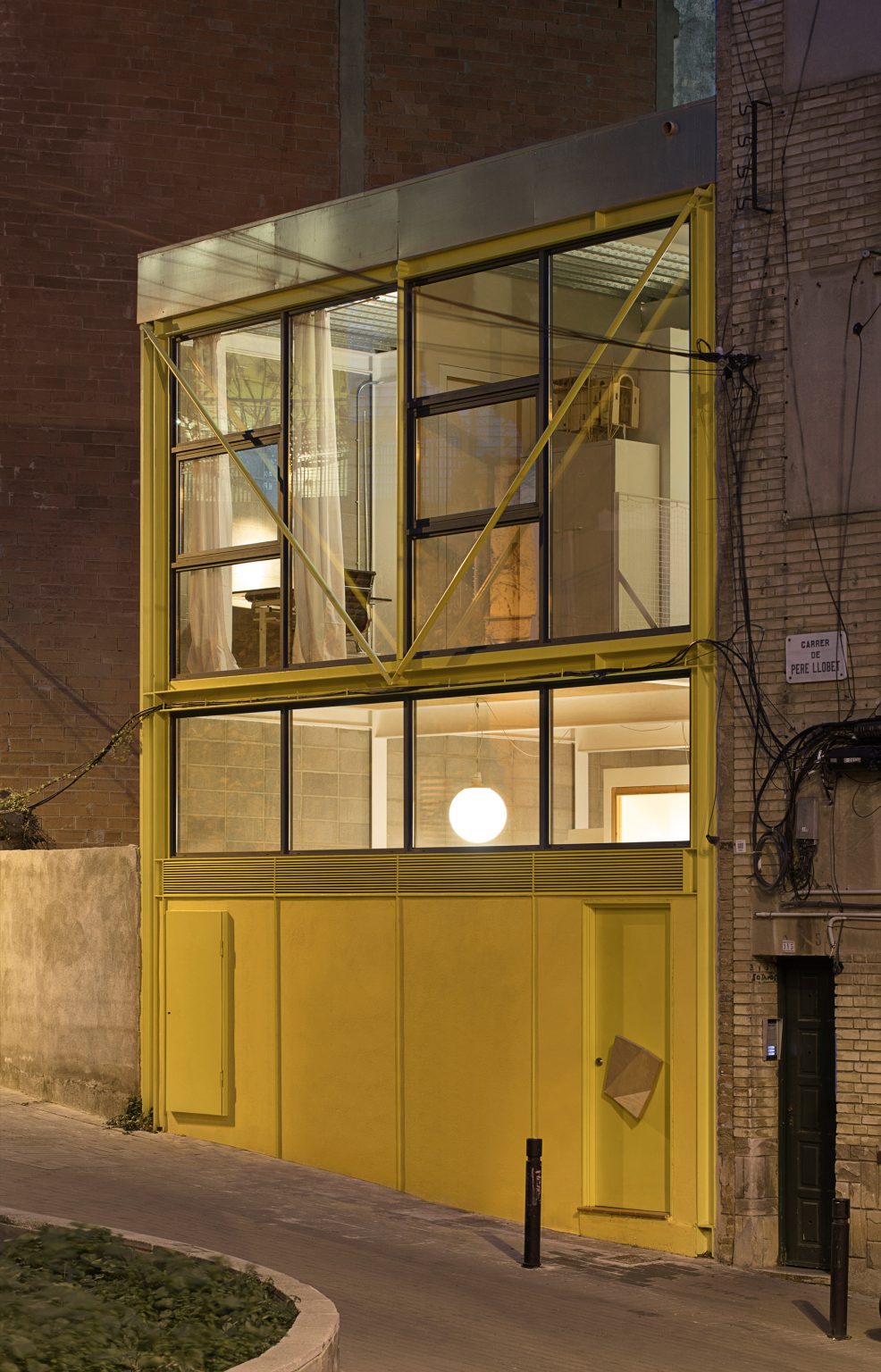 Yellow exterior of Casa Collumpio by MACH