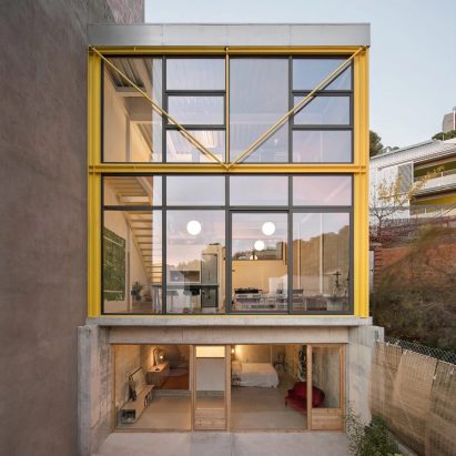A house with a bright yellow facade features in today’s Dezeen Debate newsletter