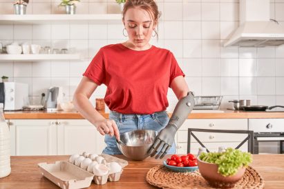 A woman cooking with an Esper Hand