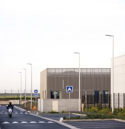 Building with perforated metal cladding