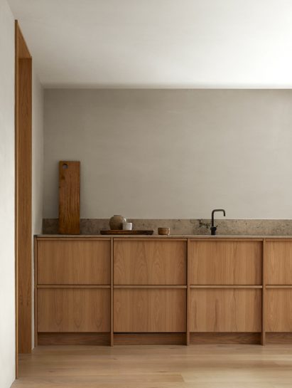 Timber cabinetry in kitchen of Swedish holiday cabin