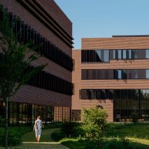 Vertical bands of glazing span between brick