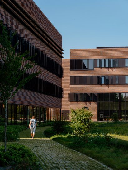 A winding path meanders between the brick veterinary buildings