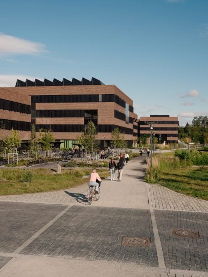 Image of people walking towards the brick-clad veterinary building