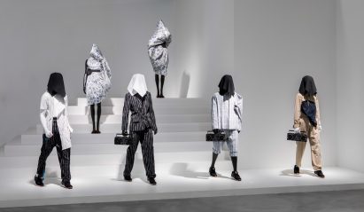 Mannequins are placed on white painted stairs