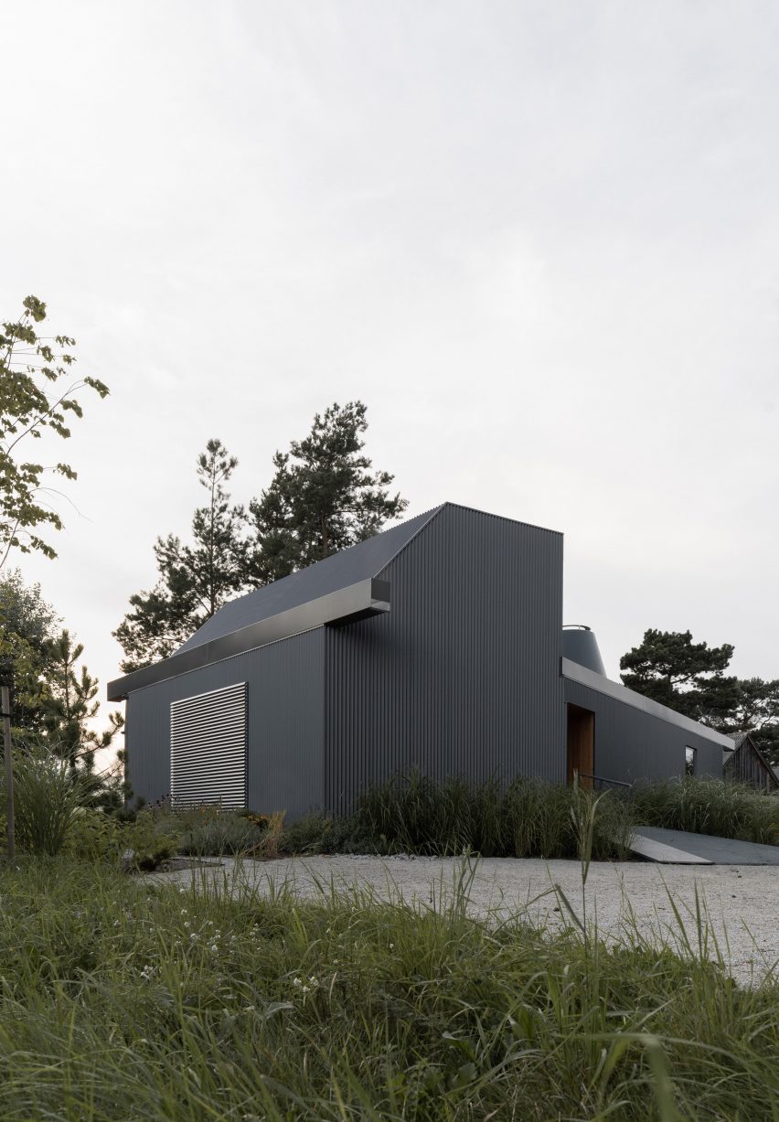 House clad with corrugated metal