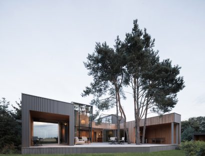 Polish house with wooden terrace by UGO