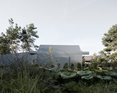 House clad with corrugated metal