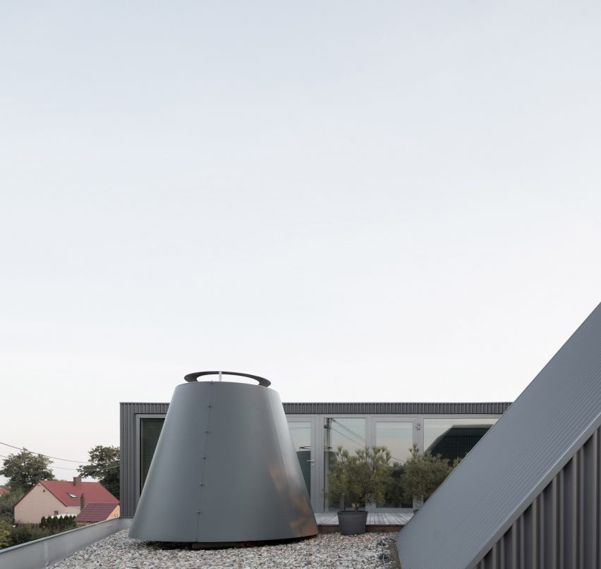House clad with corrugated metal