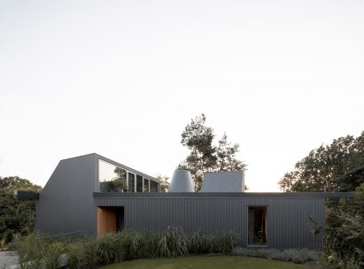 House clad with corrugated metal