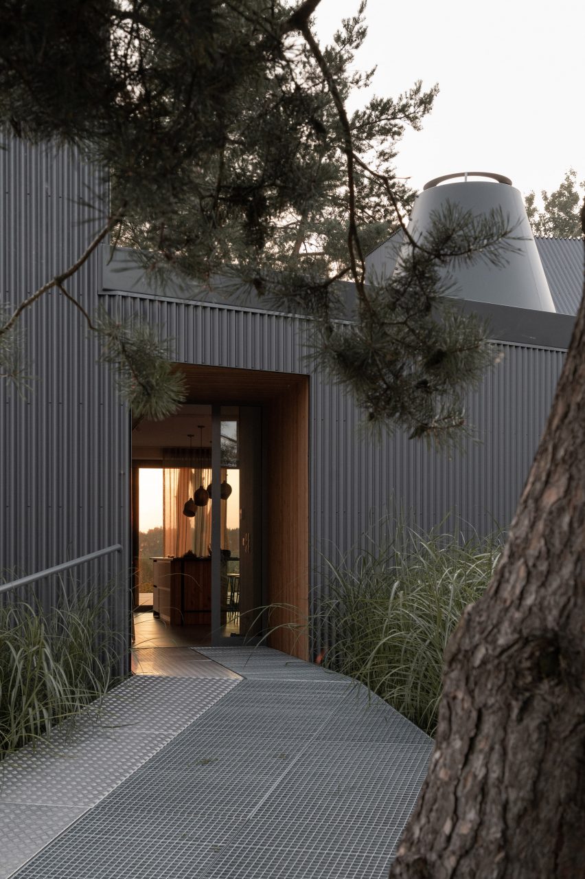 House clad with corrugated metal