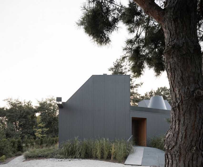 House clad with corrugated metal