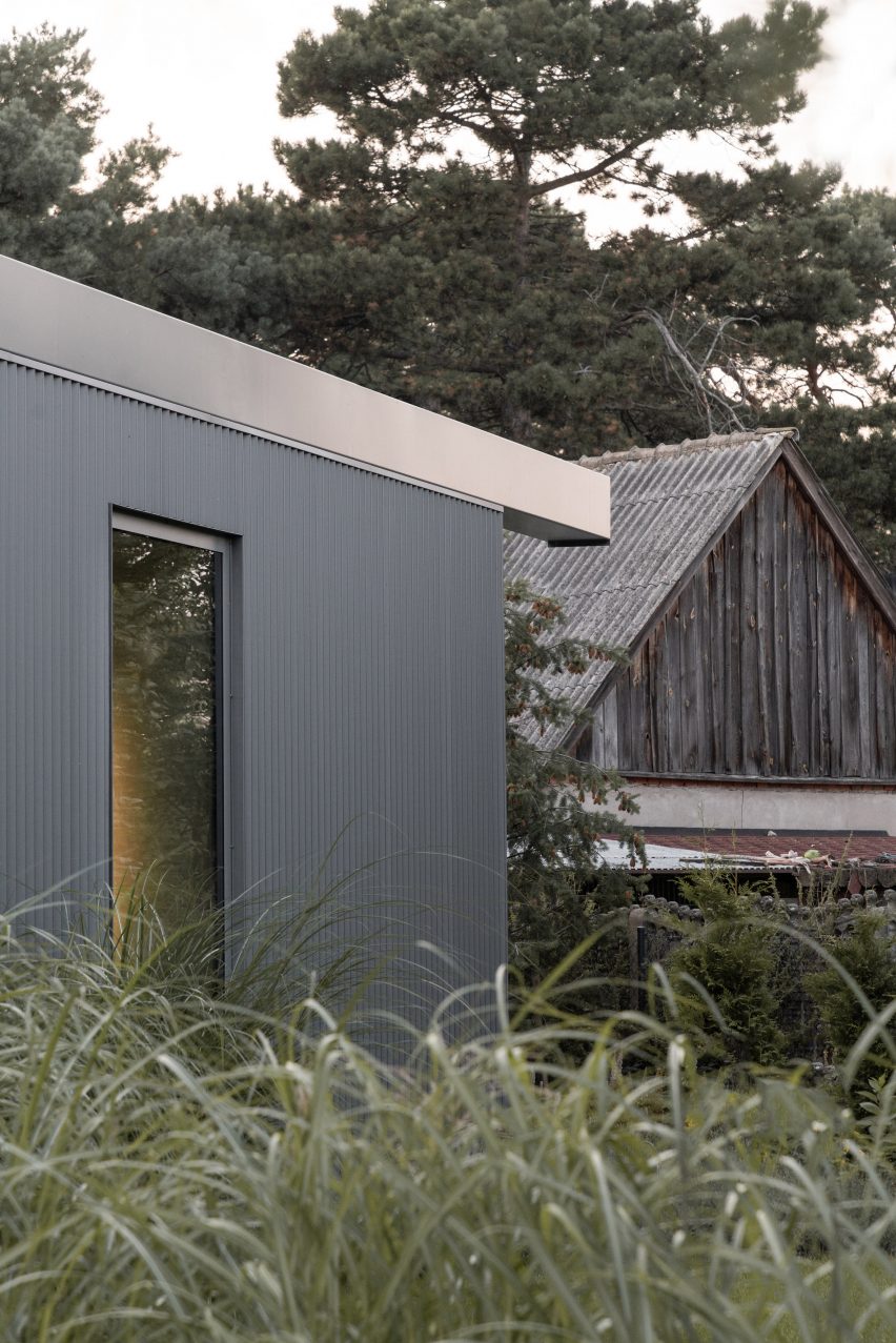 House clad with corrugated metal