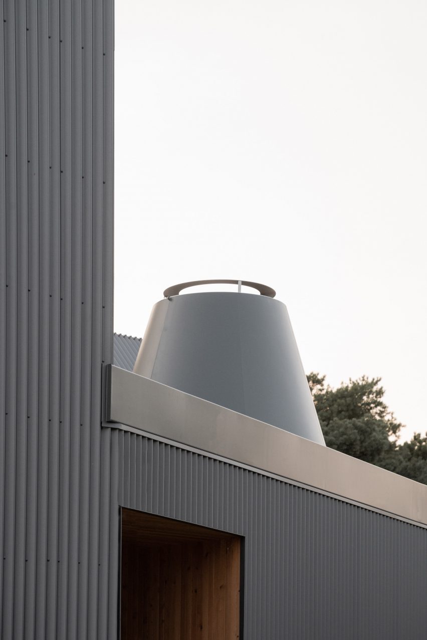 House clad with corrugated metal