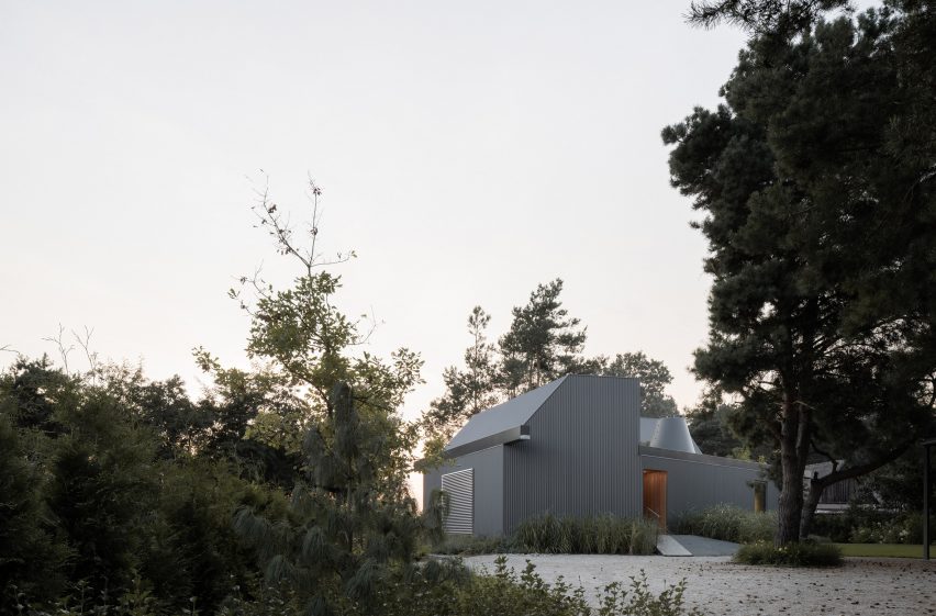 House clad with corrugated metal