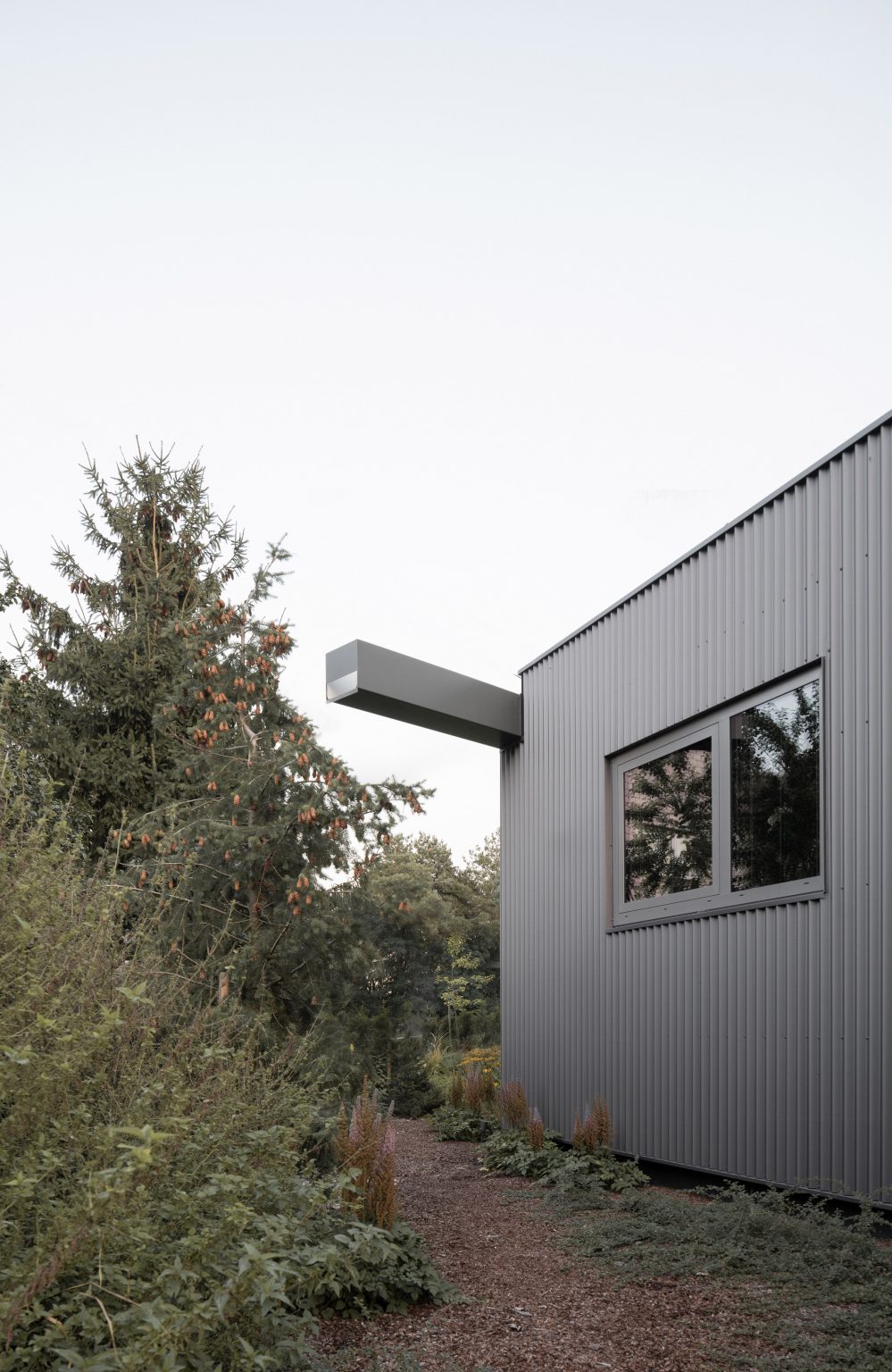 House clad with corrugated metal
