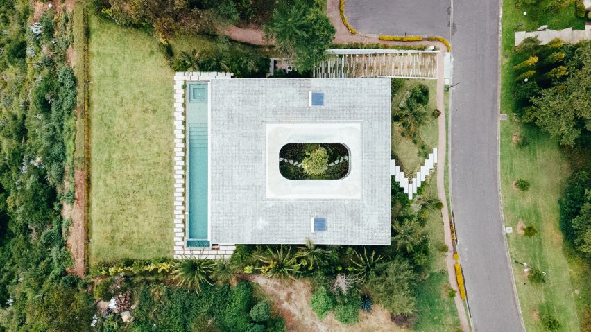 Felipe Escudero arranges concrete house around central magnolia tree