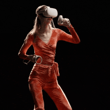 Models at Maisie Wilen's AW22 fashion show wearing a VR headset and an orange two-piece