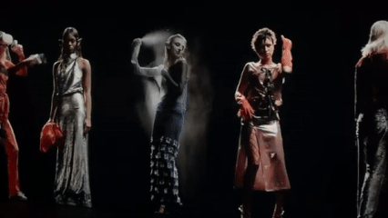 Five hologram models at Maisie Wilen's AW22 fashion show at New York Fashion Week