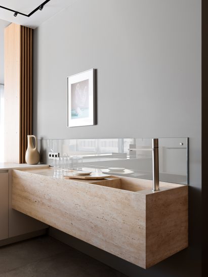 A sandy coloured sink attached to a wall