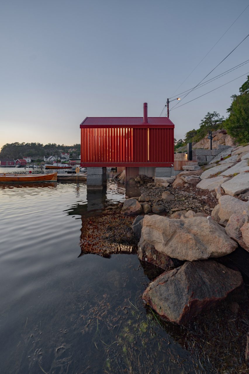 Red cabin on granite stilts