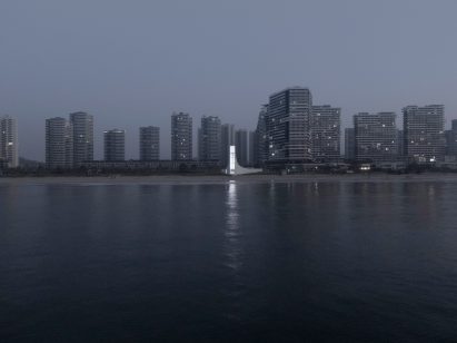 The Seaside Chapel of Jinting Bay pictured illuminated on the coastline