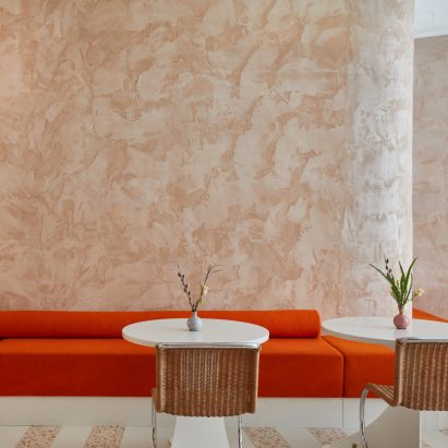 Red banquette seating at Ottolenghi Chelsea