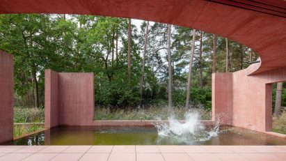 The patio and swimming pond of the Refuge with curved roof overhead