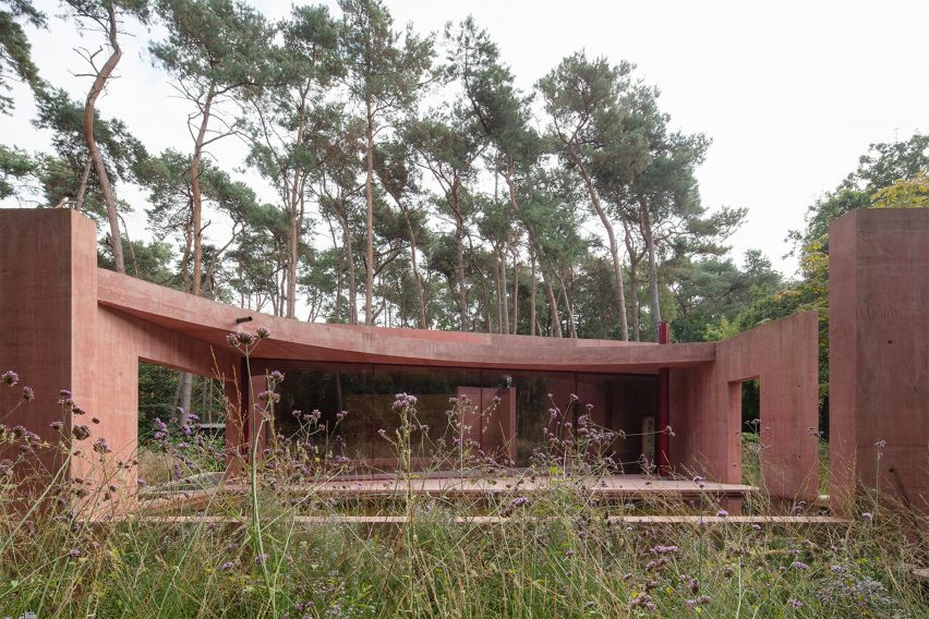 Exterior of the Refuge looking towards the pool house through an opening in the pavilion walls