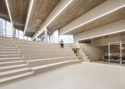 Auditorium with stepped seating by COBE