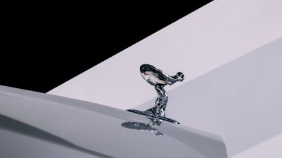 A silver Spirit of Ecstasy figurine