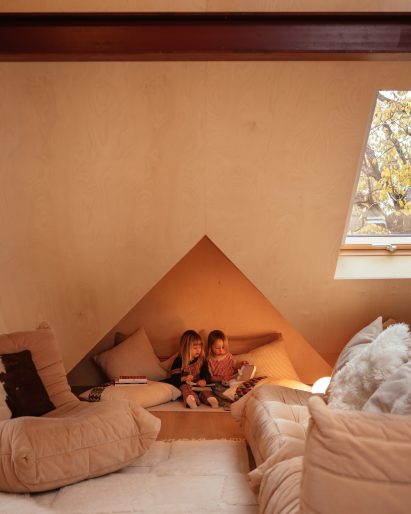 Openings in the sloped roof become snug areas at Loft 62